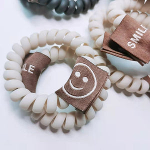 Smiling tag hair ties/pack