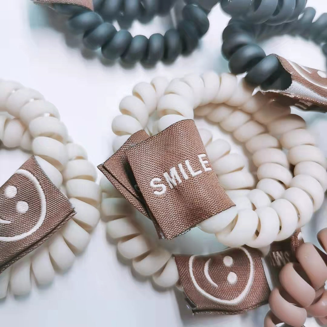 Smiling tag hair ties/pack