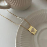 Load image into Gallery viewer, Gold Heart Tag Pearl Necklace
